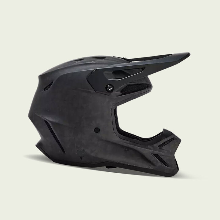 Black V3RS motocross helmet on a white background.