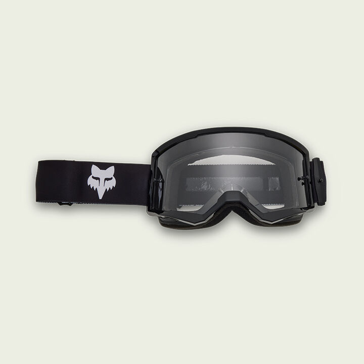 Black goggles on green background
