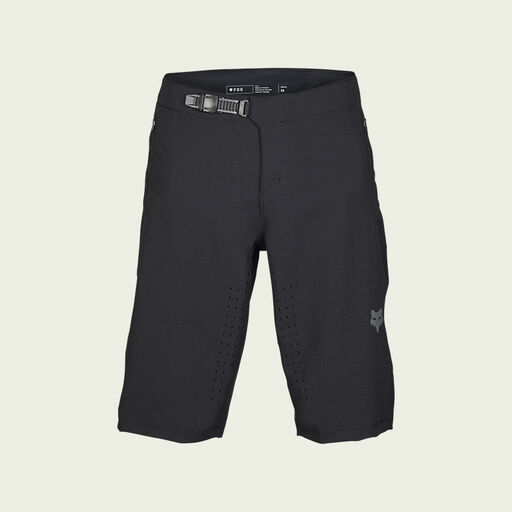 dark mtb shorts on green background