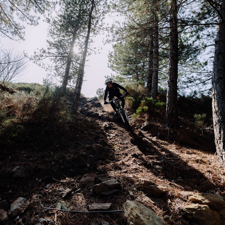 Riding on a descending a steep hill.